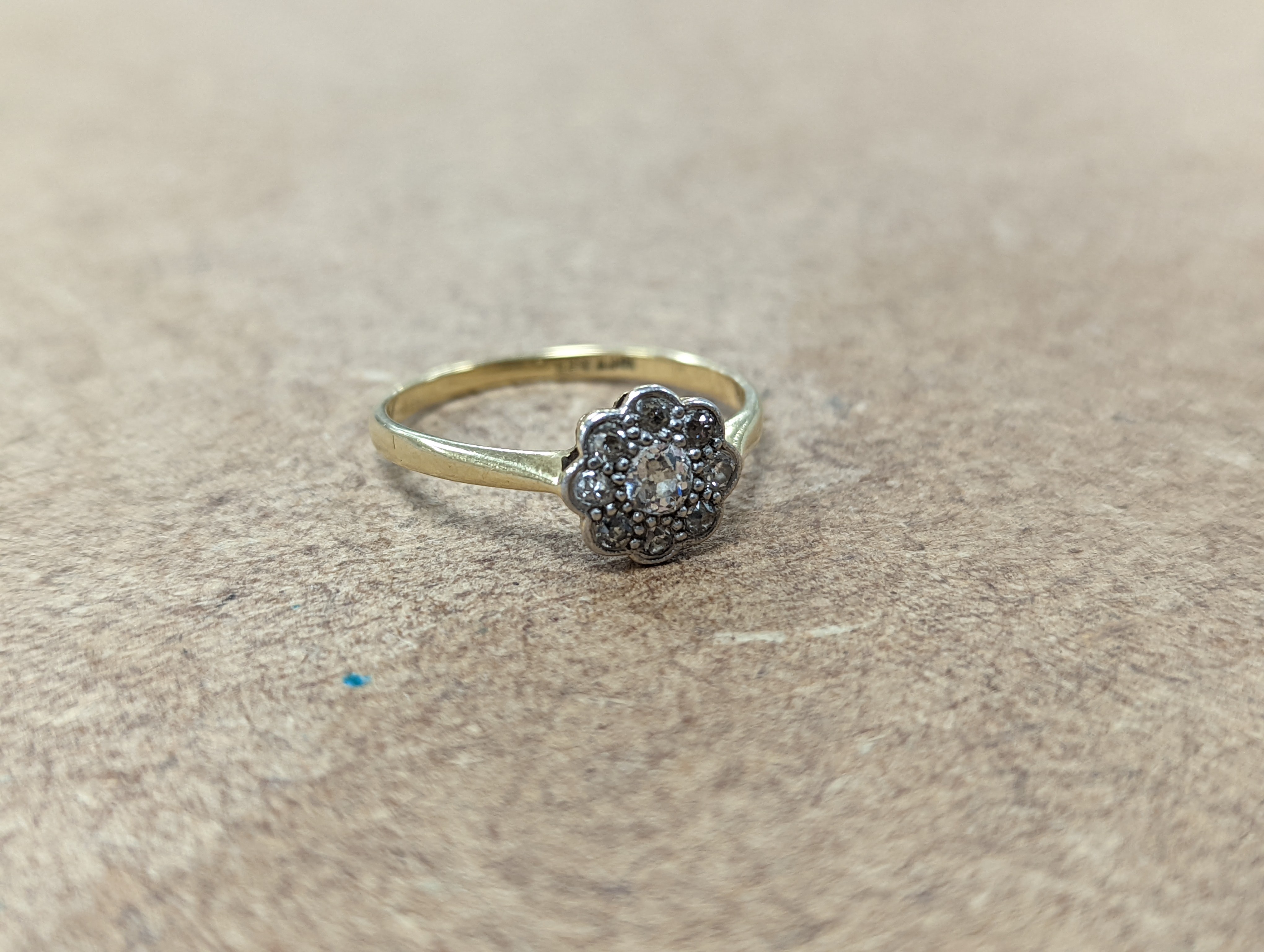 Two 18ct and diamond cluster rings, gross 5.3 grams, a 585 and diamond chip ring, gross 1.7 grams, a 9ct gold gem set ring and two 9ct pendants, gross 8.9 grams.